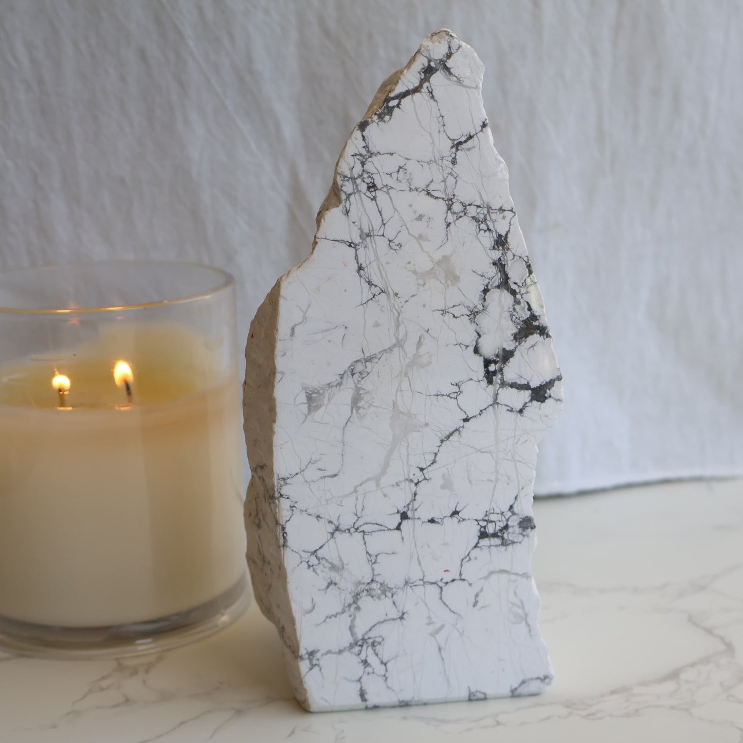 howlite freeform with polished face and natural raw side showing grey veining patterns