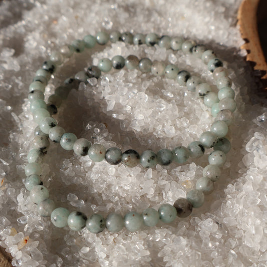 Kiwi Jasper 4mm bead stretch bracelet with soft green beads and natural black, cream and dark speckled markings.