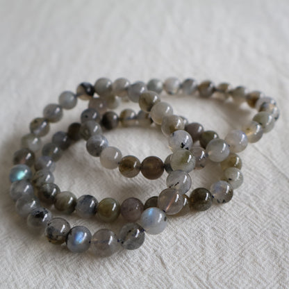 Labradorite 8mm crystal bead bracelets with natural grey tones, inclusions and iridescent flash.