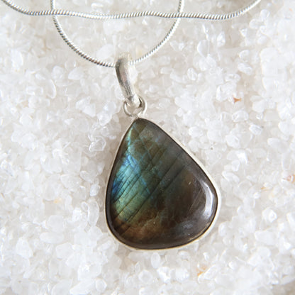 Labradorite crystal pendant with blue and gold flash and wrapped s925 silver border, exact piece shown
