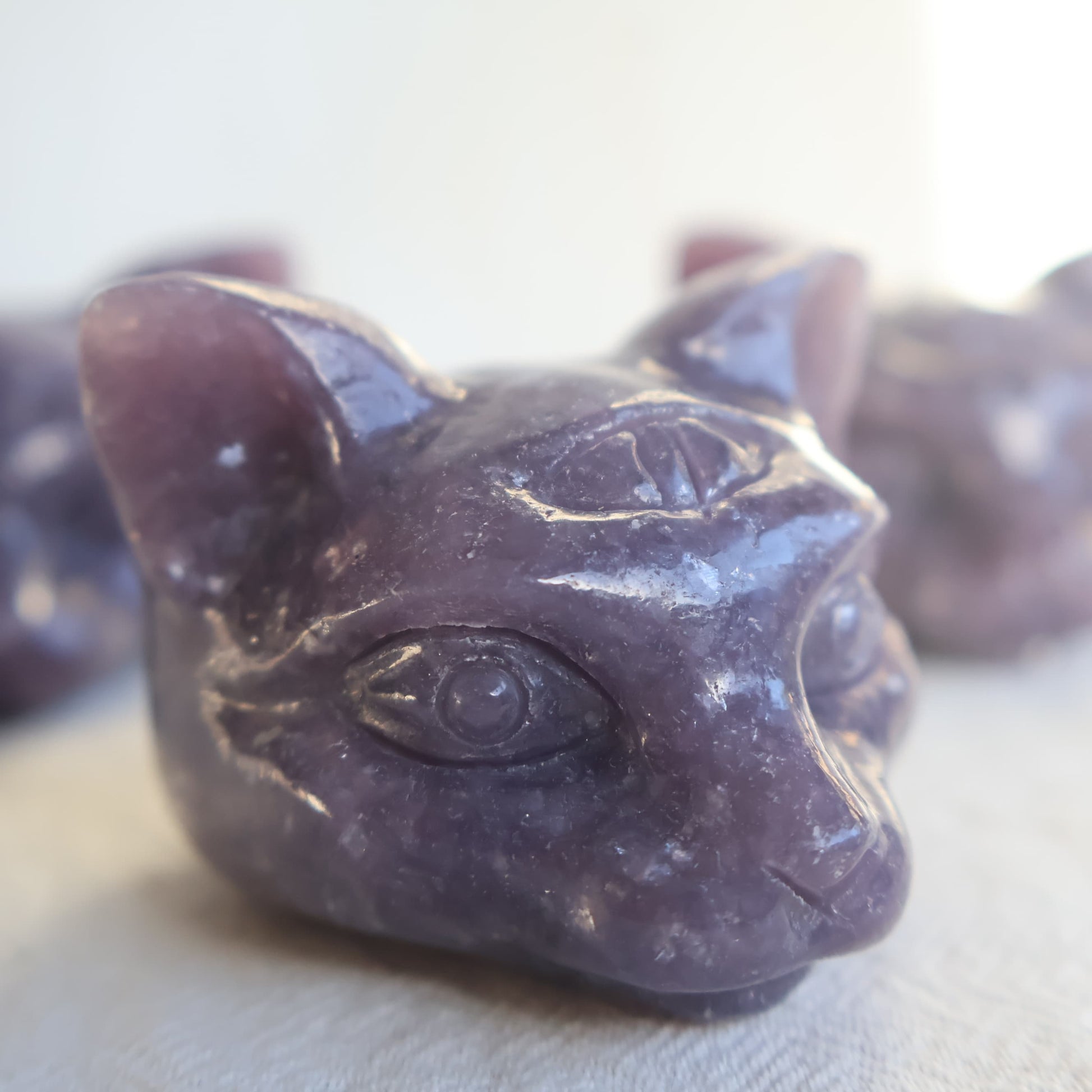 Lepidolite third eye cat carving with soft lavender tones
