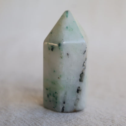 Collection of mini crystal generators available in Phoenix Stone, Rose Quartz, Pyrite, Moss Agate, and Sodalite with polished pointed tops and natural colour variations.