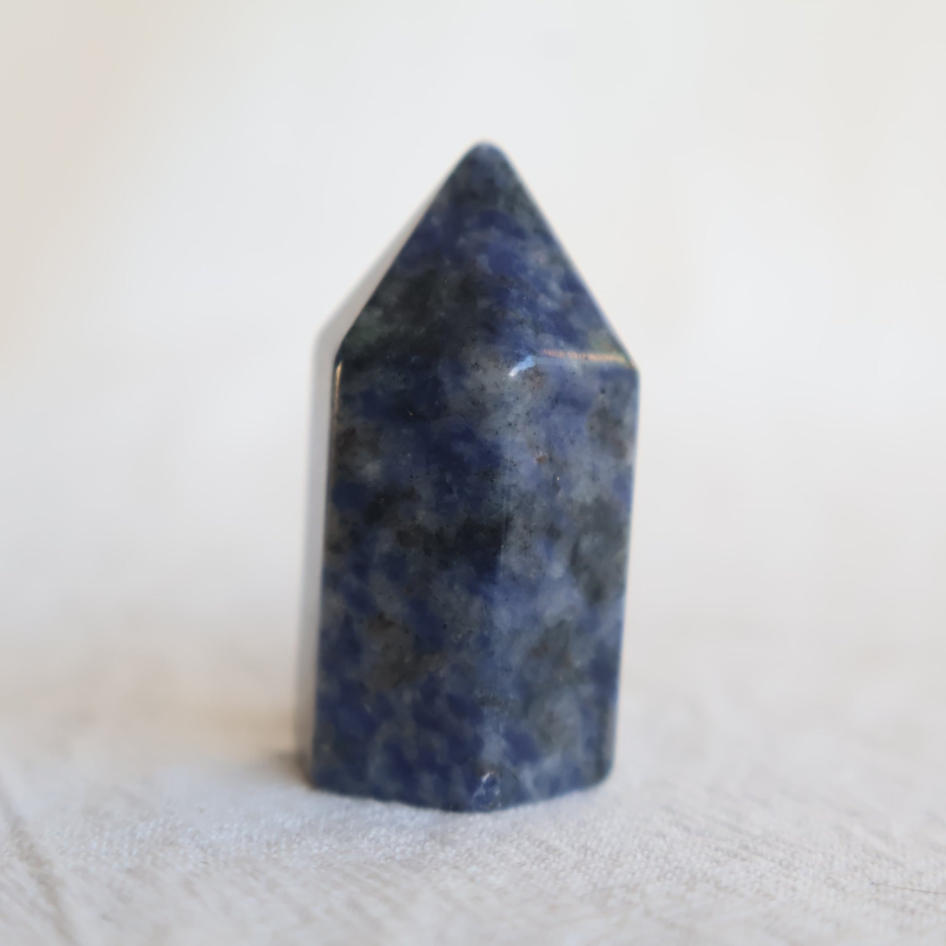 Collection of mini crystal generators available in Phoenix Stone, Rose Quartz, Pyrite, Moss Agate, and Sodalite with polished pointed tops and natural colour variations.