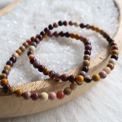 Natural Mookaite 4mm crystal bead bracelet featuring earthy shades of burgundy, mustard, cream and plum on a stretch cord.
