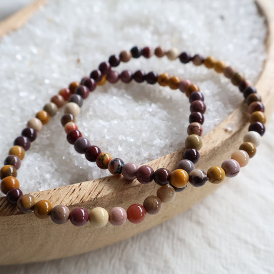 Natural Mookaite 4mm crystal bead bracelet featuring earthy shades of burgundy, mustard, cream and plum on a stretch cord.