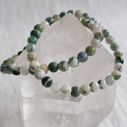 Moss Agate crystal bracelet with polished 6mm round beads and natural moss-like mineral inclusions.