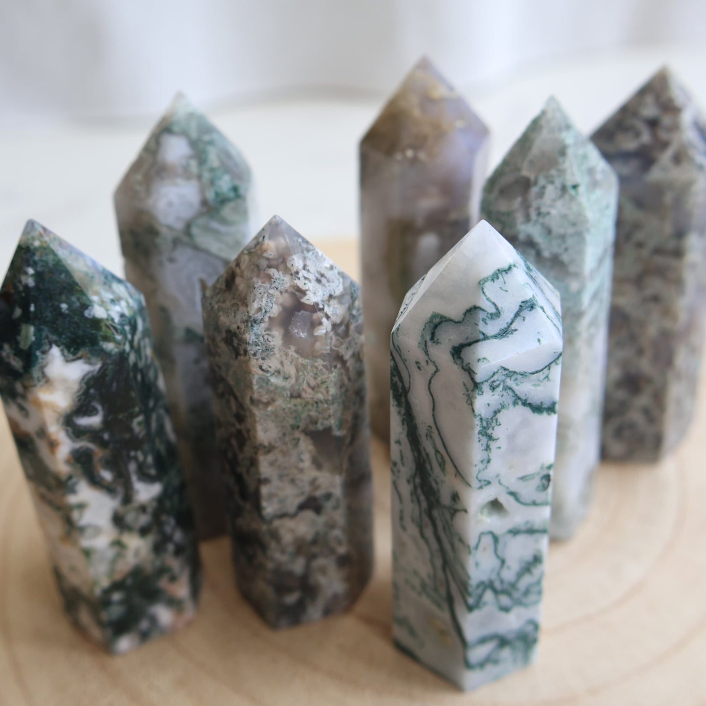 white and green dendritic moss agate generator polished point