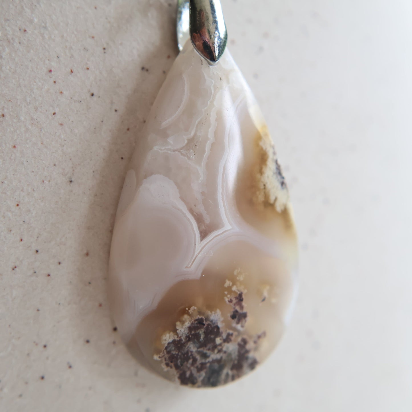 Moss agate crystal pendant with natural inclusions, exact piece shown.