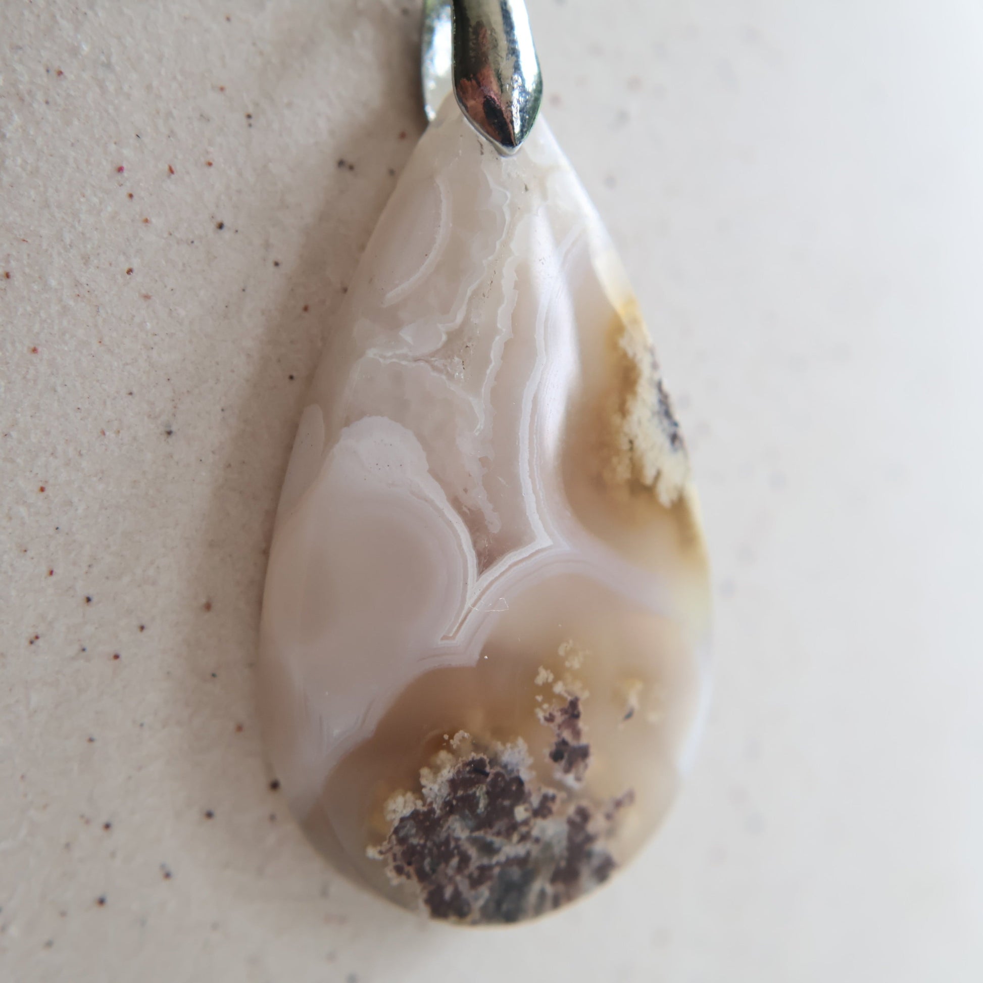 Moss agate crystal pendant with natural inclusions, exact piece shown.