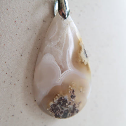 Moss agate crystal pendant with natural inclusions, exact piece shown.