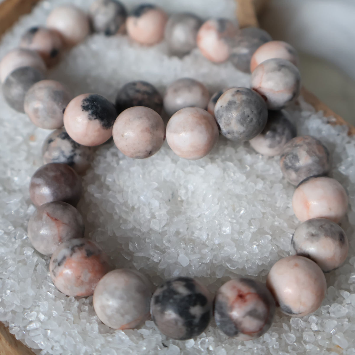Pink Agate 12mm bead stretch bracelet with soft pink colouring and natural variations and subtle patterning throughout the beads.