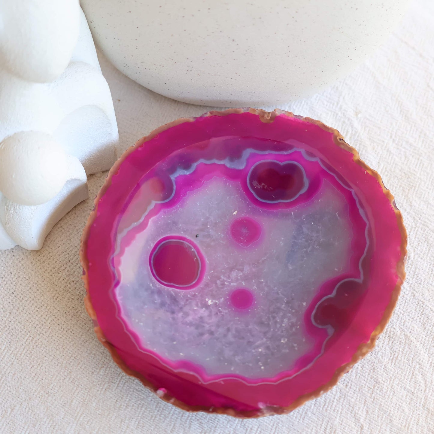 Dyed Pink Agate crystal bowl with vibrant pink colouring, natural agate banding, polished finish, and shallow round shape
