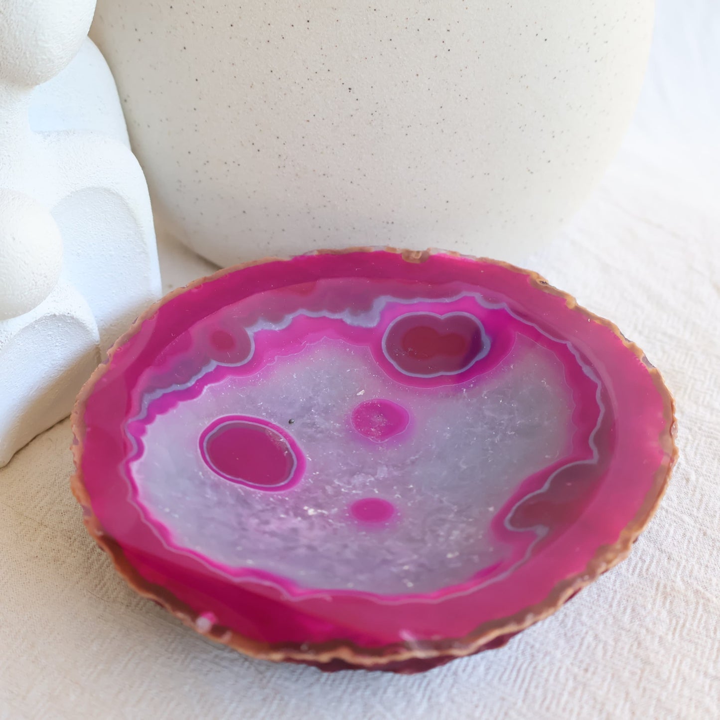 Dyed Pink Agate crystal bowl with vibrant pink colouring, natural agate banding, polished finish, and shallow round shape