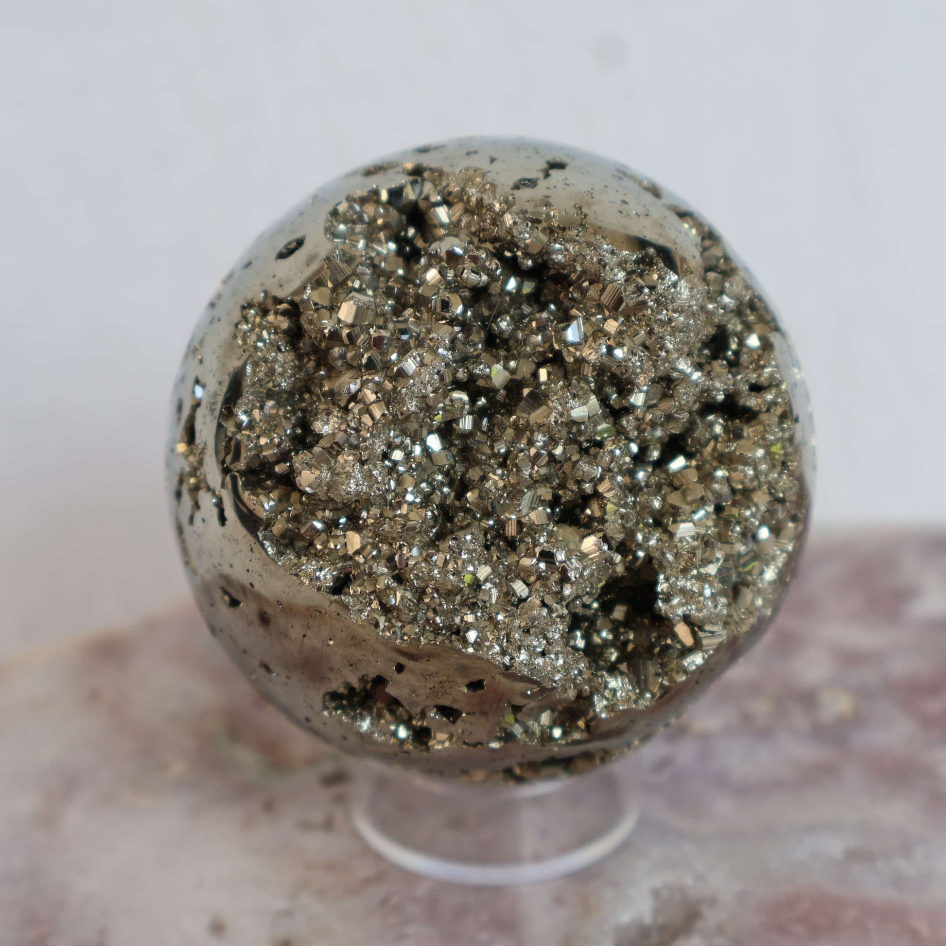 Peruvian pyrite crystal sphere with natural clusters polished stone – Stonewild