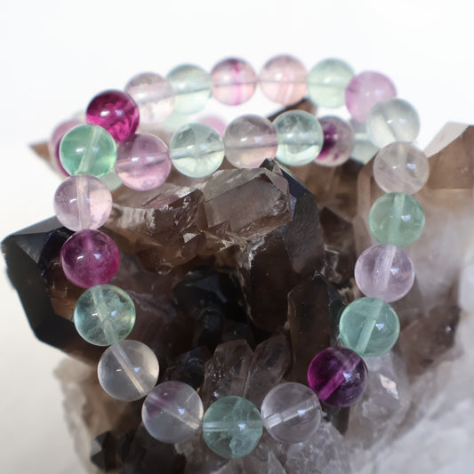 Rainbow Fluorite 8mm bead stretch bracelet with natural purple, green and translucent tones and unique colour banding.