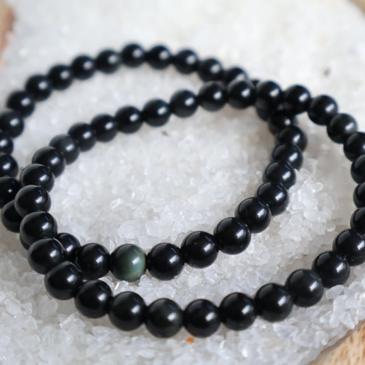 Rainbow Obsidian 6mm bead stretch bracelet with deep black beads and subtle natural rainbow flashes that appear in the light.