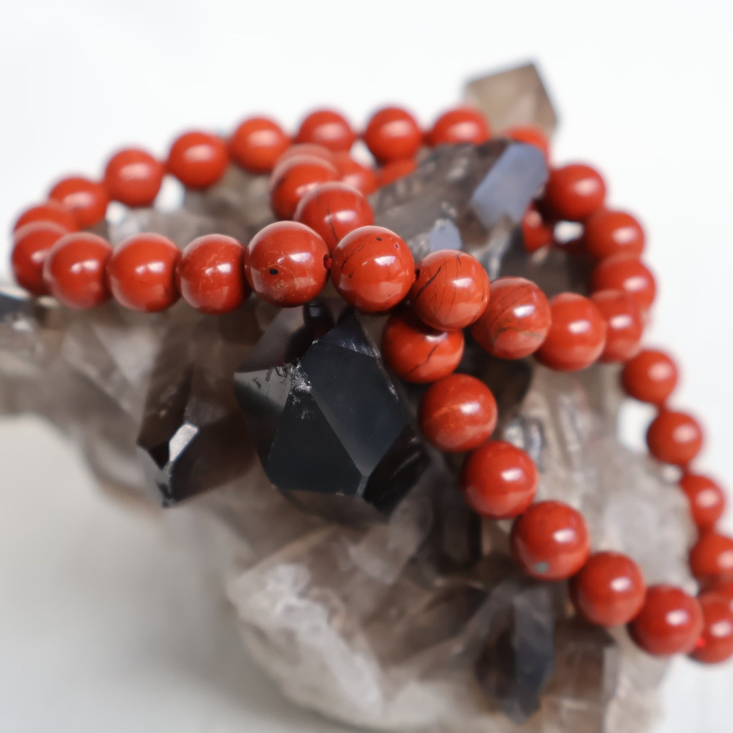 Red Jasper 8mm bead stretch bracelet with smooth, rich earthy red beads and subtle natural colour variations.