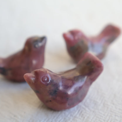 Mini Rhodonite bird carving with natural pink and black veining