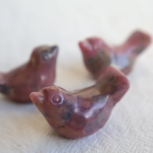 Mini Rhodonite bird carving with natural pink and black veining