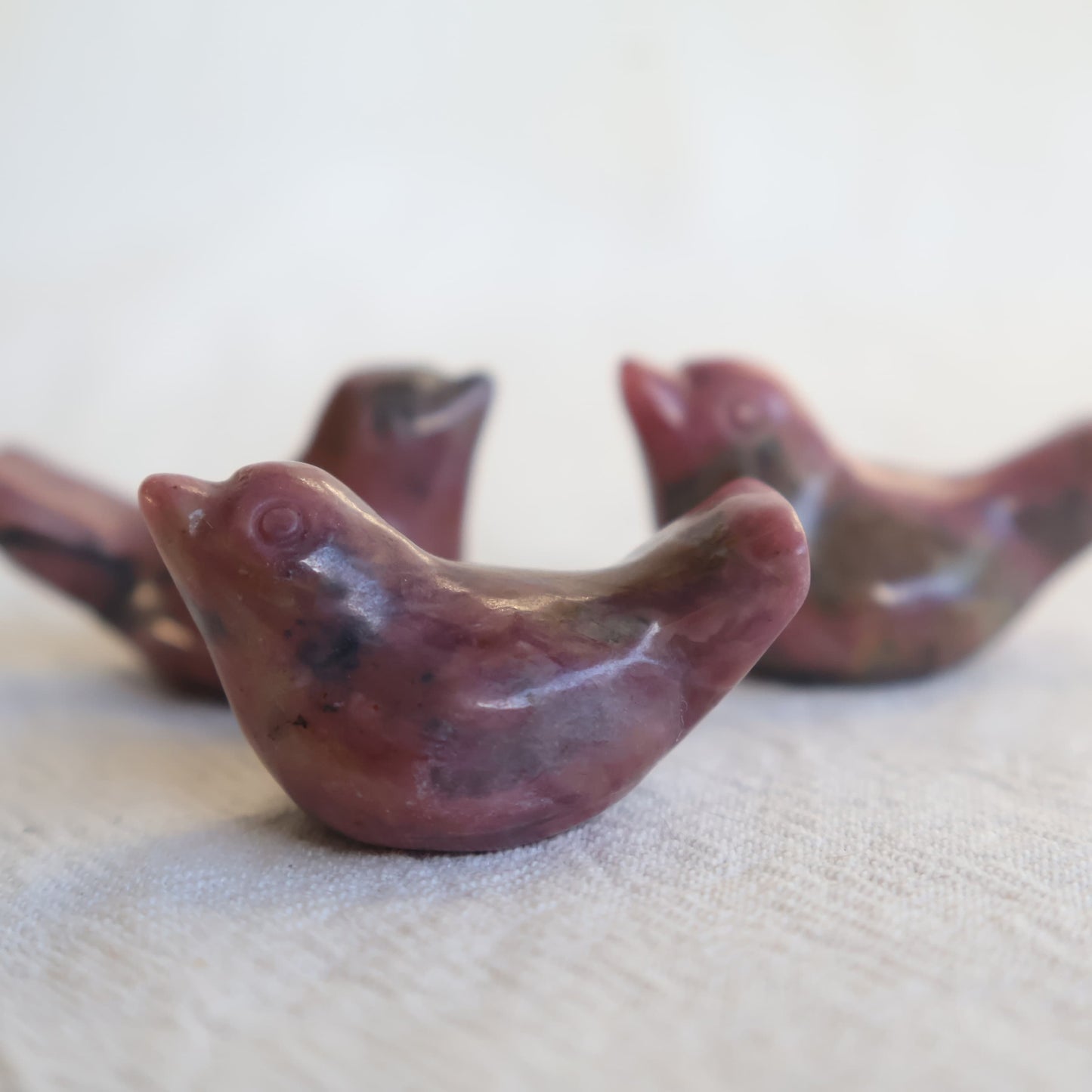 Mini Rhodonite bird carving with natural pink and black veining