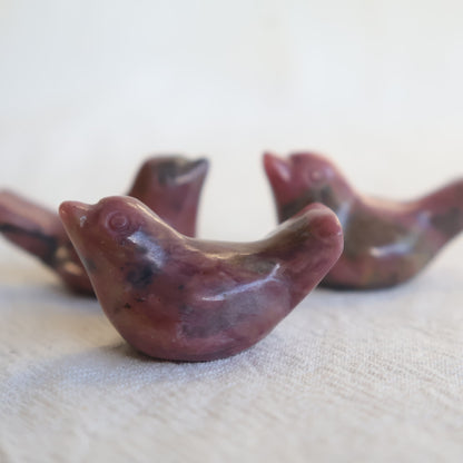 Mini Rhodonite bird carving with natural pink and black veining