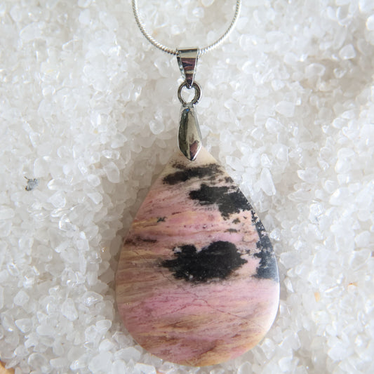 Rhodonite crystal pendant with soft pink tones and natural dark veining, exact piece shown