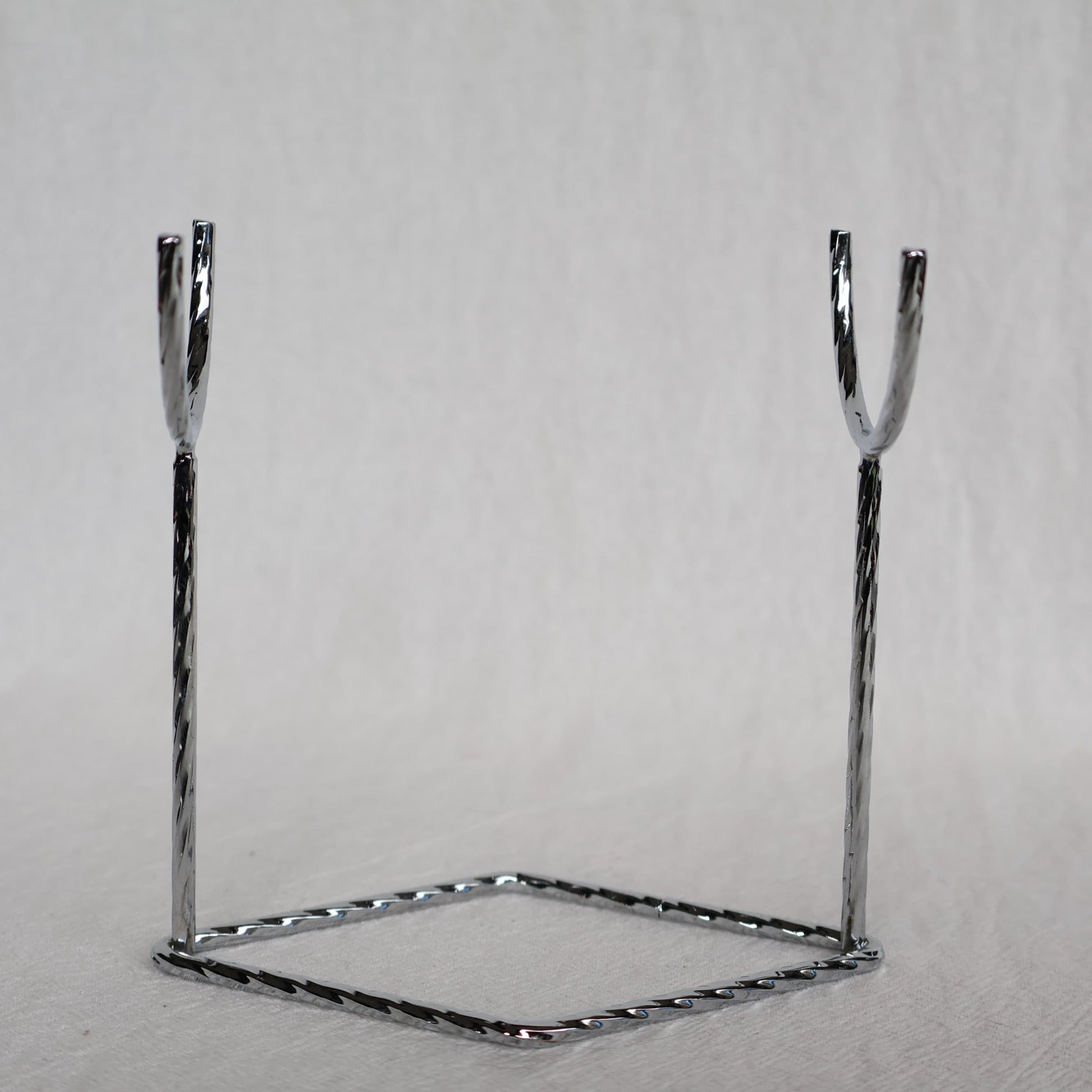 Metal crystal rod and wand display stand available in black, silver and gold, measuring 9.5cm x 10cm.