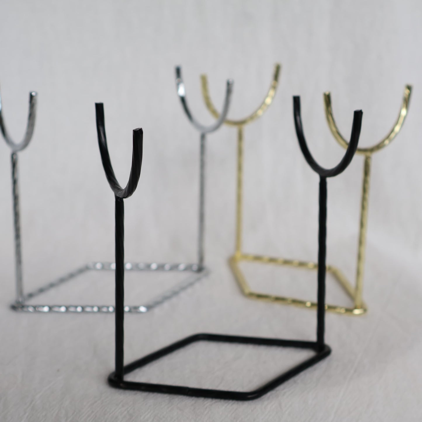 Metal crystal rod and wand display stand available in black, silver and gold, measuring 9.5cm x 10cm.