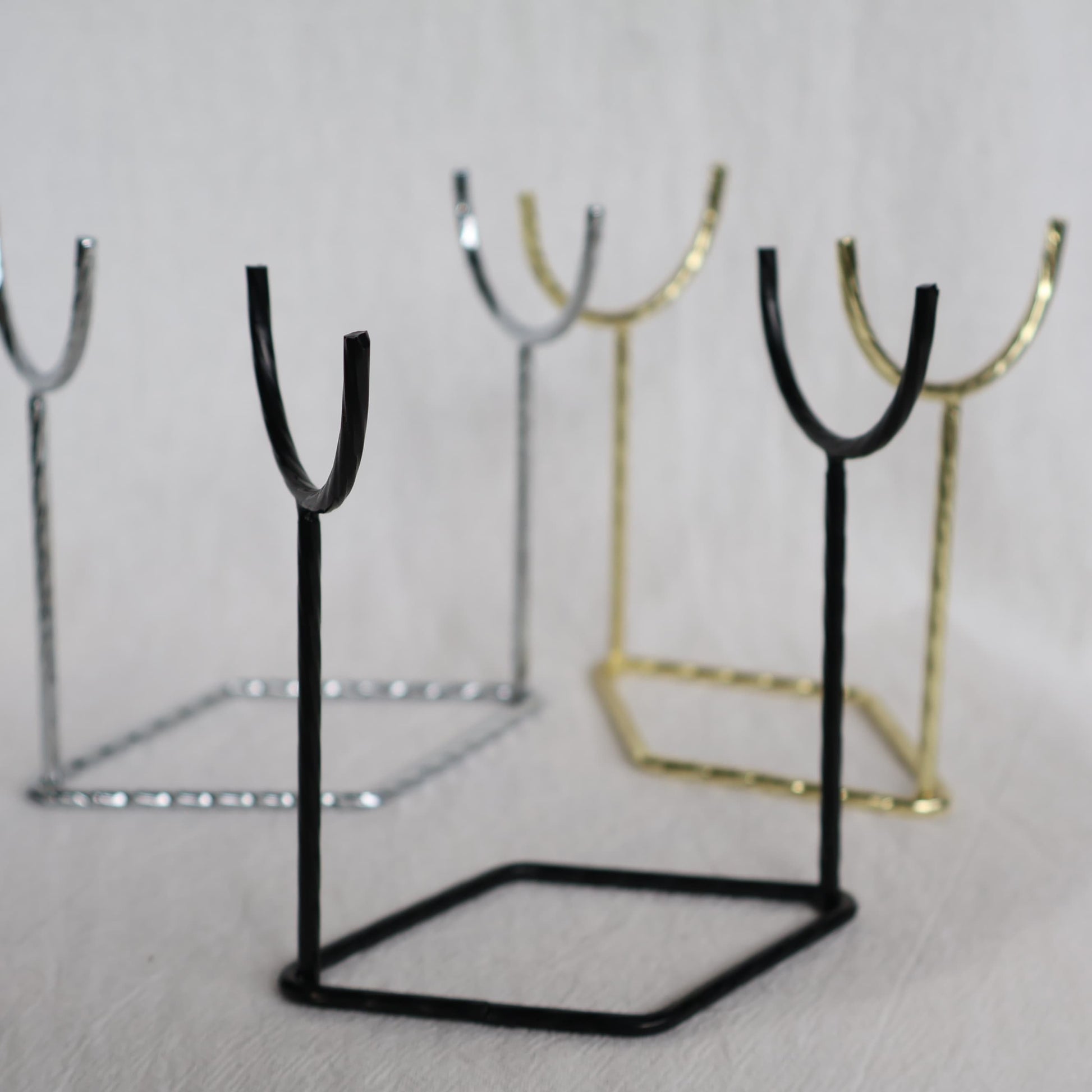 Metal crystal rod and wand display stand available in black, silver and gold, measuring 9.5cm x 10cm.