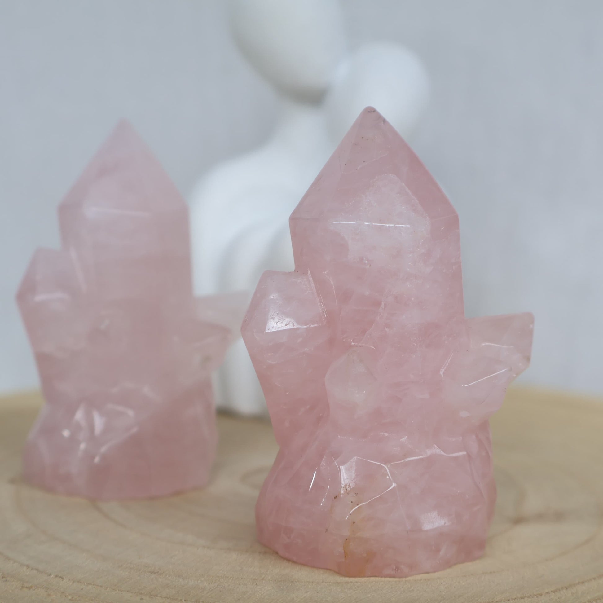 Rose Quartz crystal cluster carving in soft natural pink tones, approximately 8cm tall with multiple carved crystal points.
