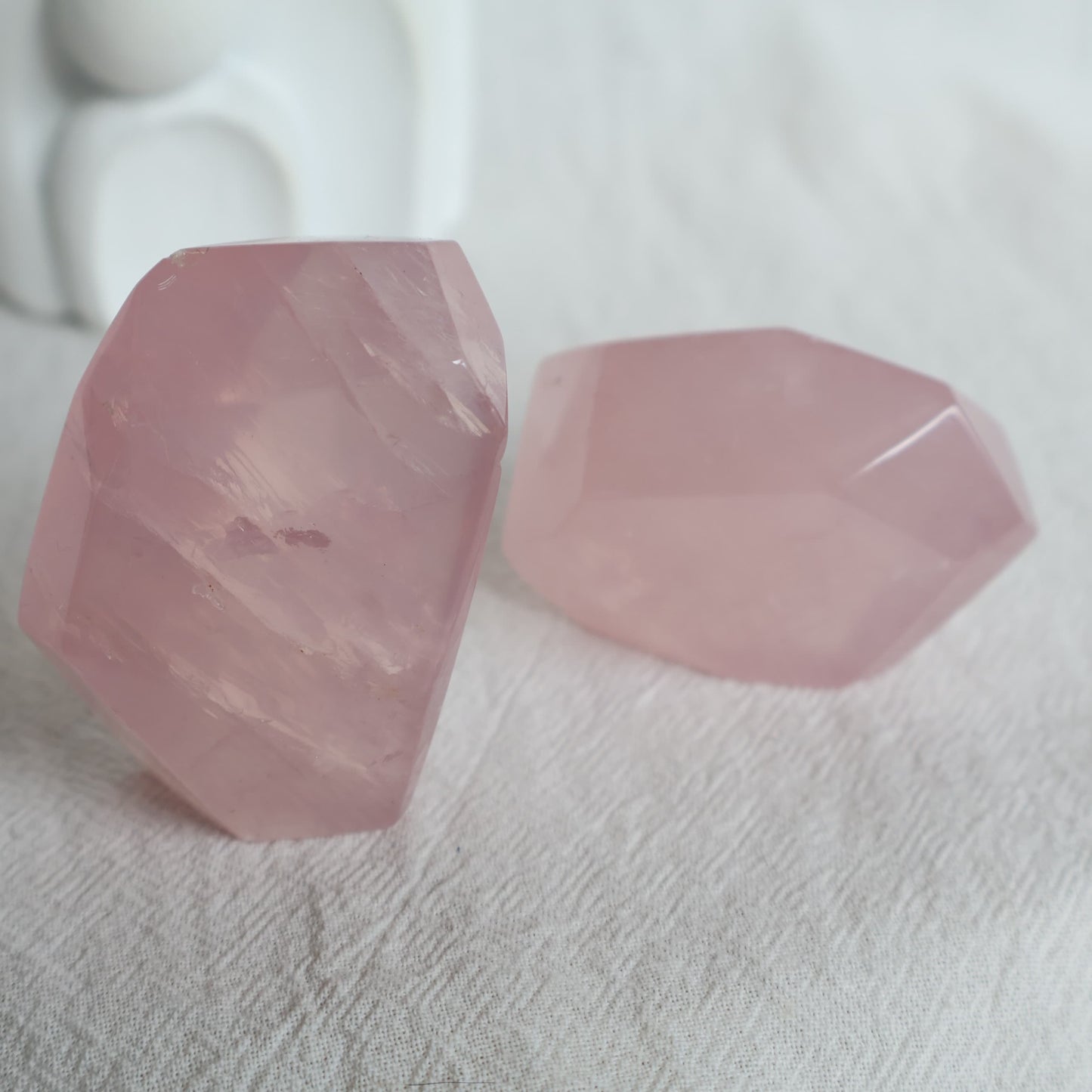 Polished Rose Quartz freeform with soft pink colouring, a translucent jelly-like appearance and subtle natural flash.