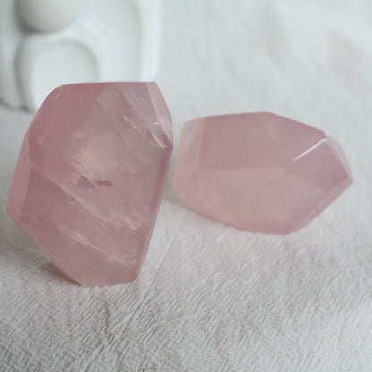 Polished Rose Quartz freeform with soft pink colouring, a translucent jelly-like appearance and subtle natural flash.