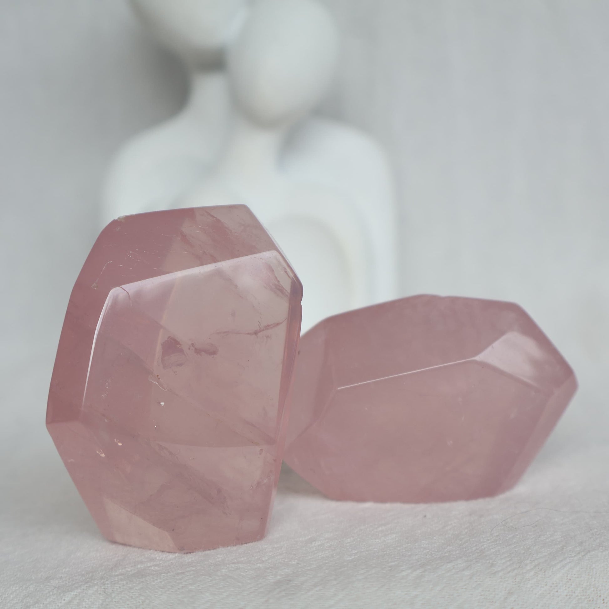 Polished Rose Quartz freeform with soft pink colouring, a translucent jelly-like appearance and subtle natural flash.