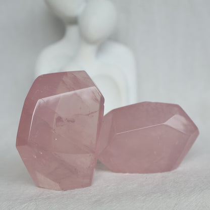 Polished Rose Quartz freeform with soft pink colouring, a translucent jelly-like appearance and subtle natural flash.