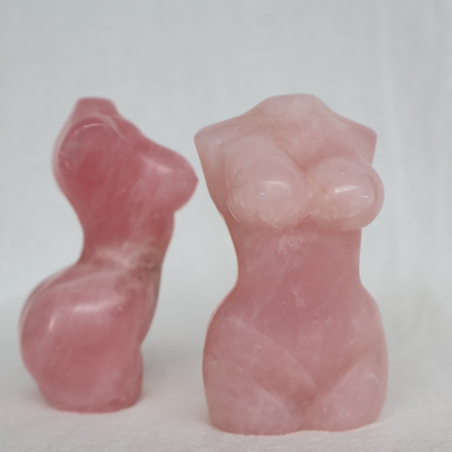 Rose Quartz Goddess carving in soft natural pink tones with unique veils and inclusions, approximately 8cm tall.