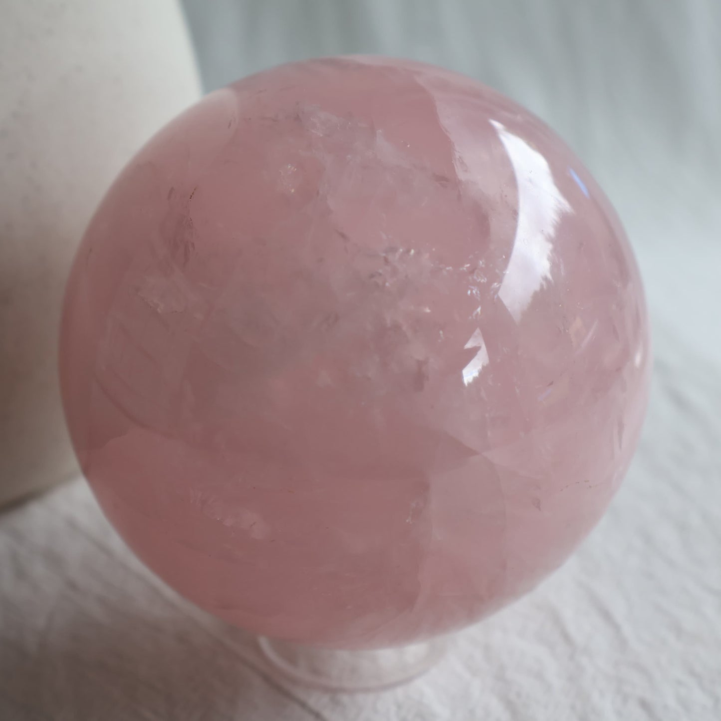 XL Rose Quartz sphere with soft blush pink colour, translucent areas and natural internal veils, polished 8.5cm crystal sphere weighing 930g