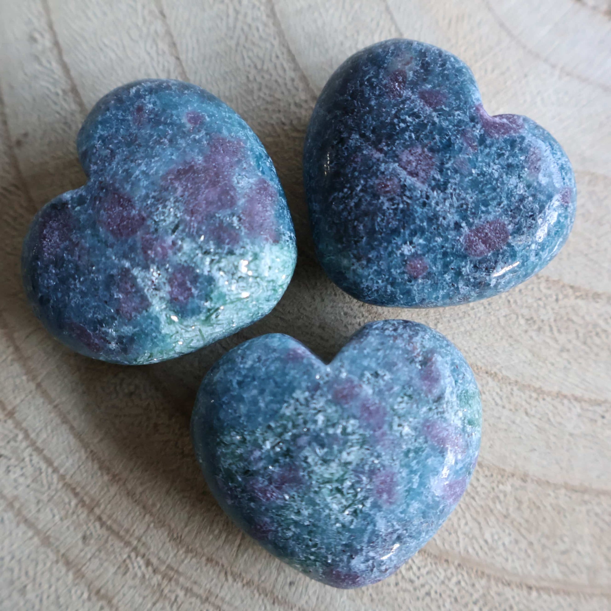 Small polished Ruby Kyanite hearts with blue-green colouring and natural deep pink and red Ruby inclusions
