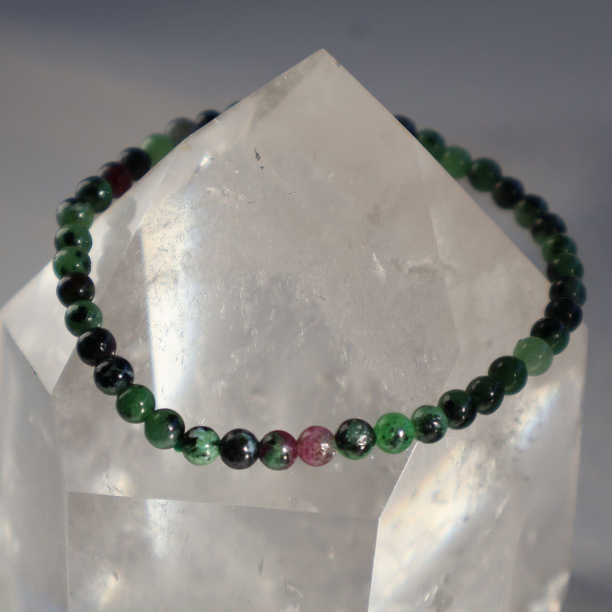Ruby in Zoisite 4mm bead stretch bracelet with earthy green Zoisite and natural deep pink to red Ruby inclusions.