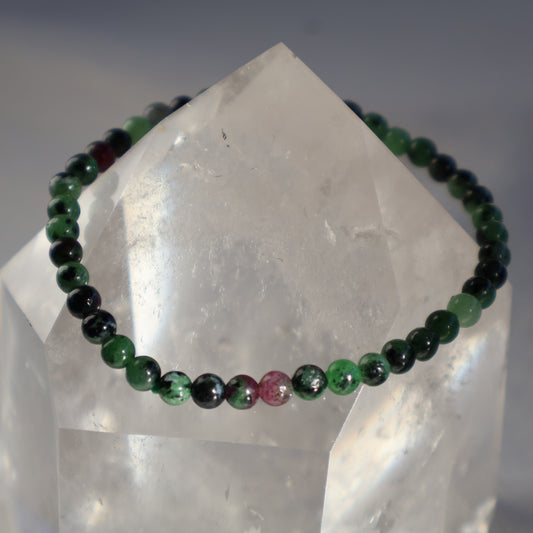 Ruby in Zoisite 4mm bead stretch bracelet with earthy green Zoisite and natural deep pink to red Ruby inclusions.