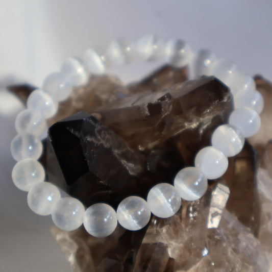 Satin Spar 8mm bead stretch bracelet with luminous white beads and a natural silky, pearly sheen.