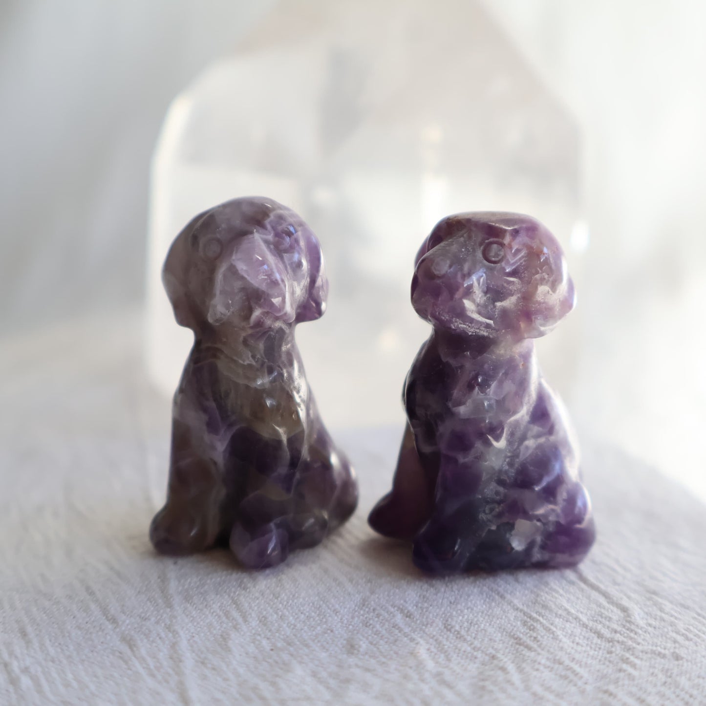 Small sitting dog crystal carvings in Labradorite and Dream Amethyst