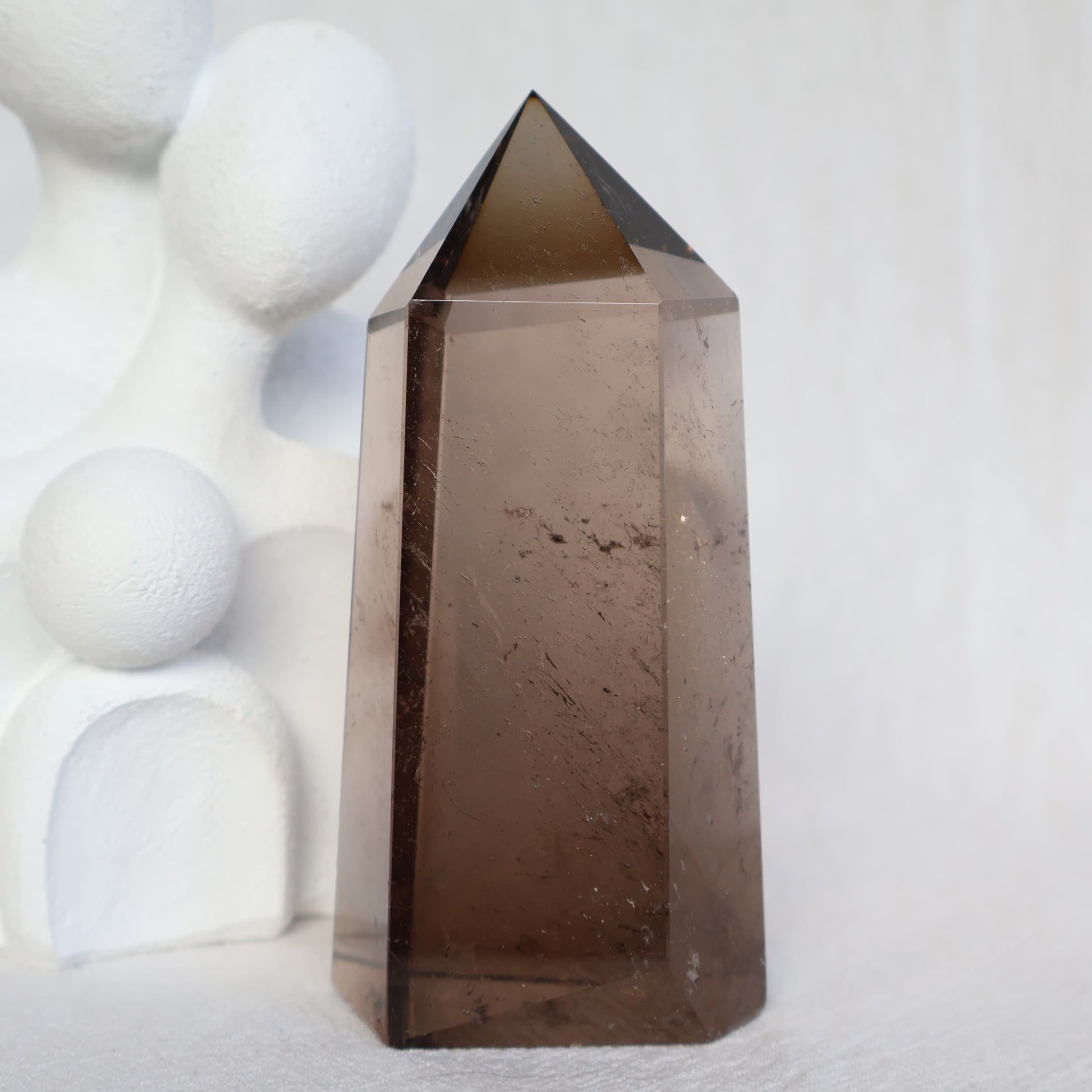 Smoky Quartz six-sided tower with natural translucent smoky brown tones, 7.5cm tall and weighing approximately 163g.