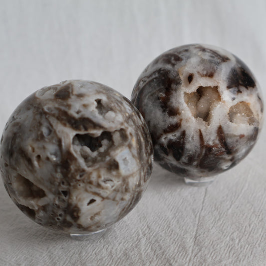 Sphalerite crystal sphere with earthy natural tones, polished patterning and sparkling druzy crystal pockets, approximately 6cm wide.