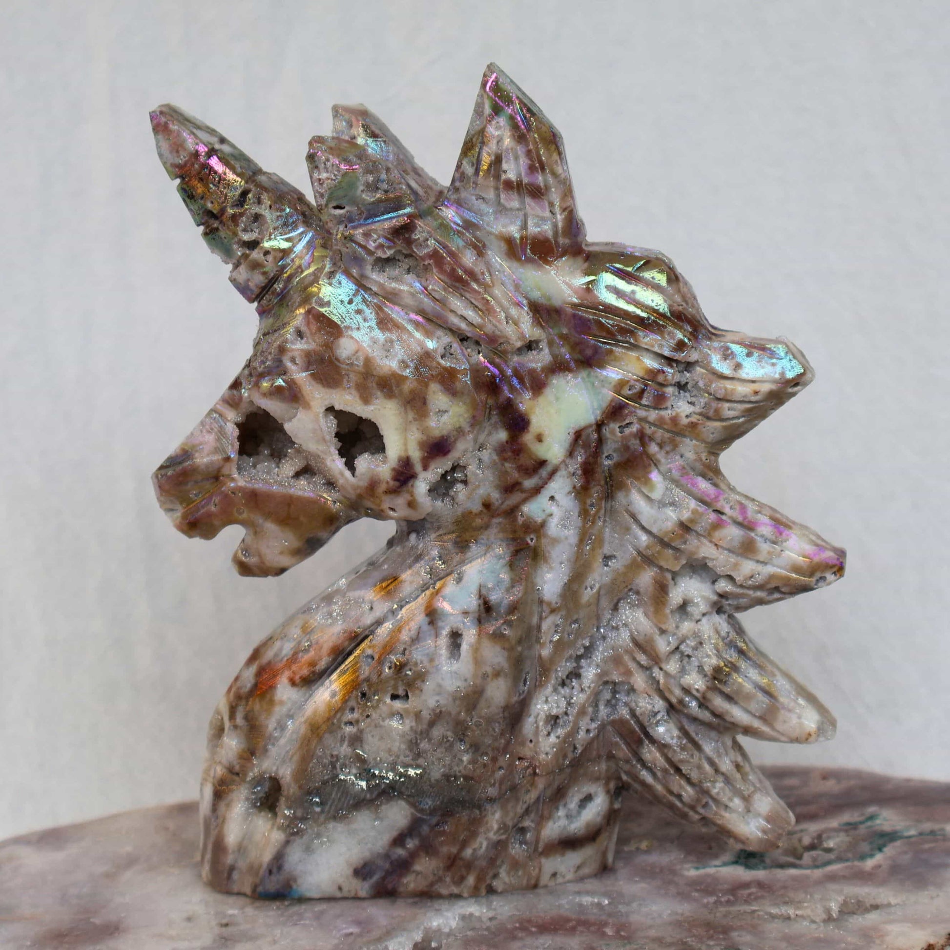 Aura coated sphalerite unicorn carving iridescent crystal – Stonewild