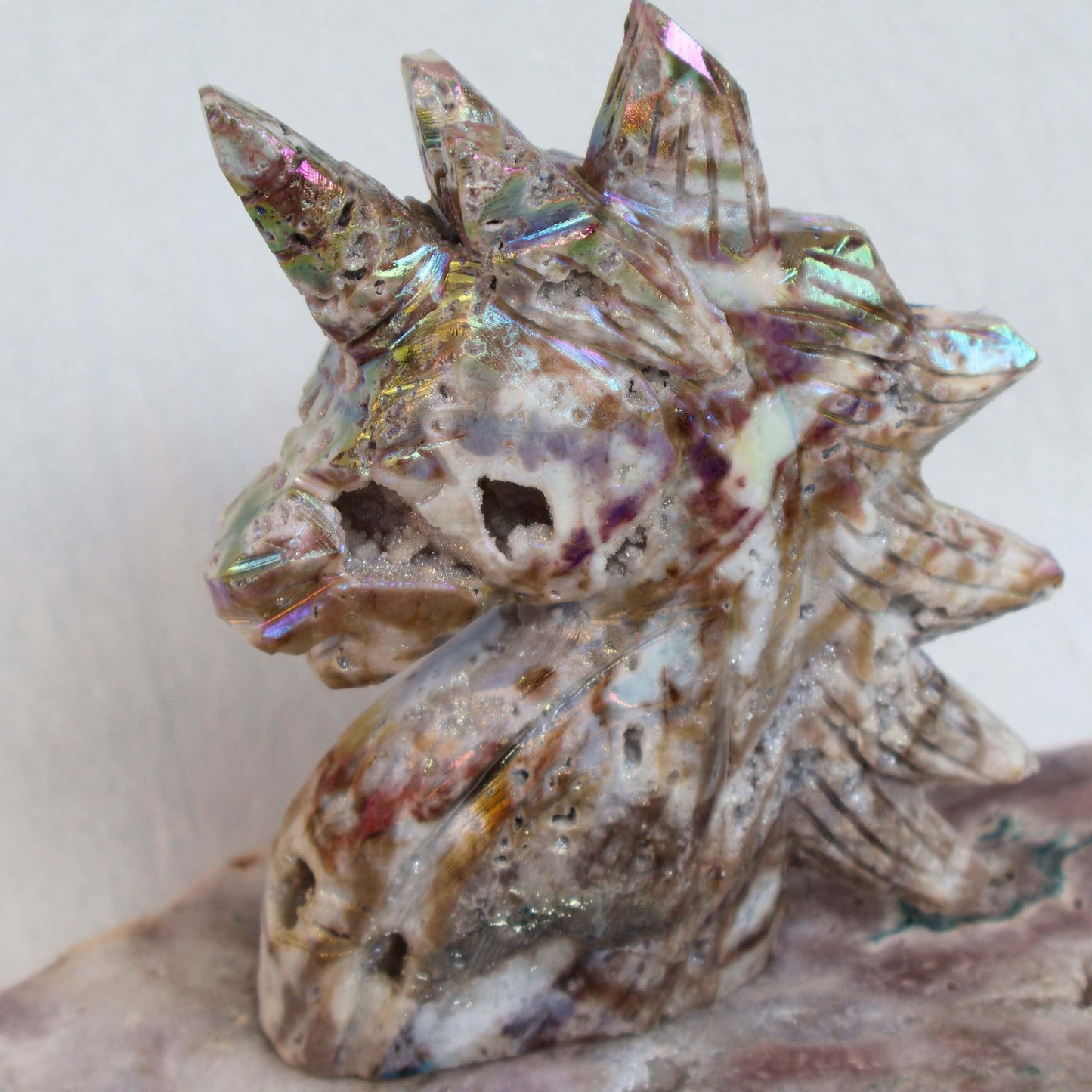 Aura coated sphalerite unicorn carving iridescent crystal – Stonewild