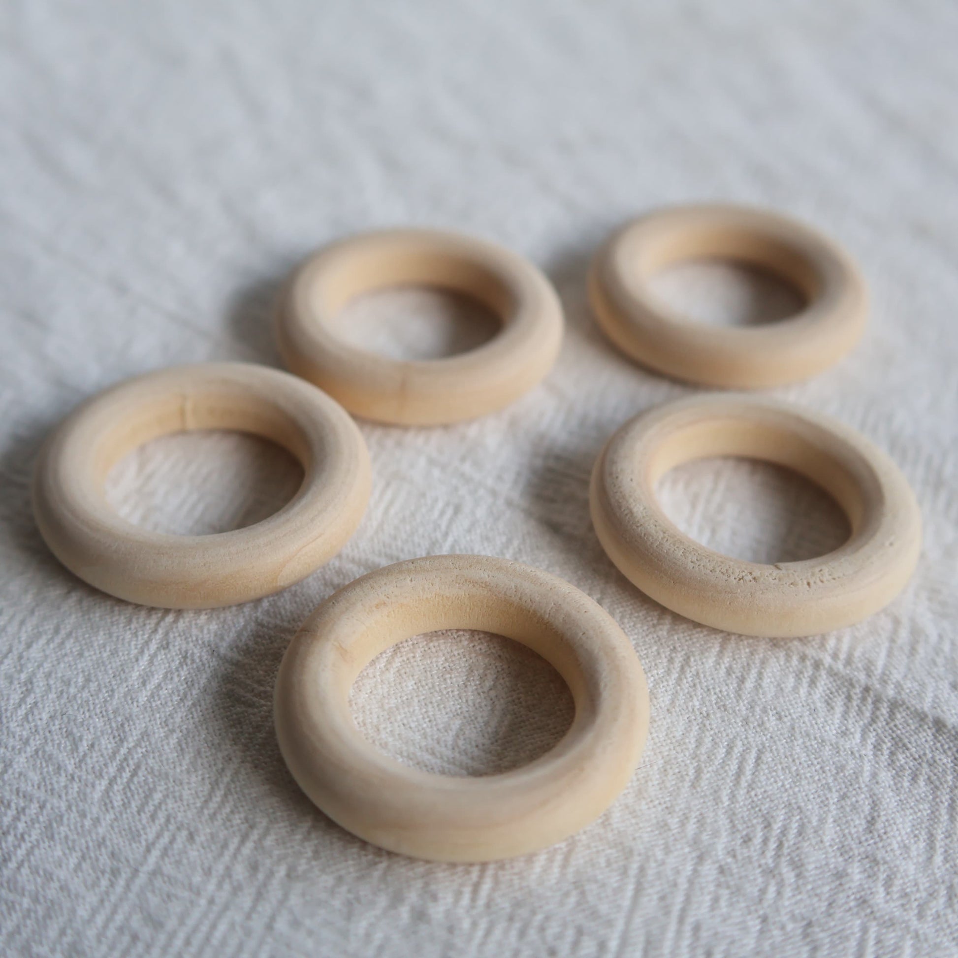 Natural wooden sphere stand ring with smooth rounded finish designed to display small and medium crystal spheres.