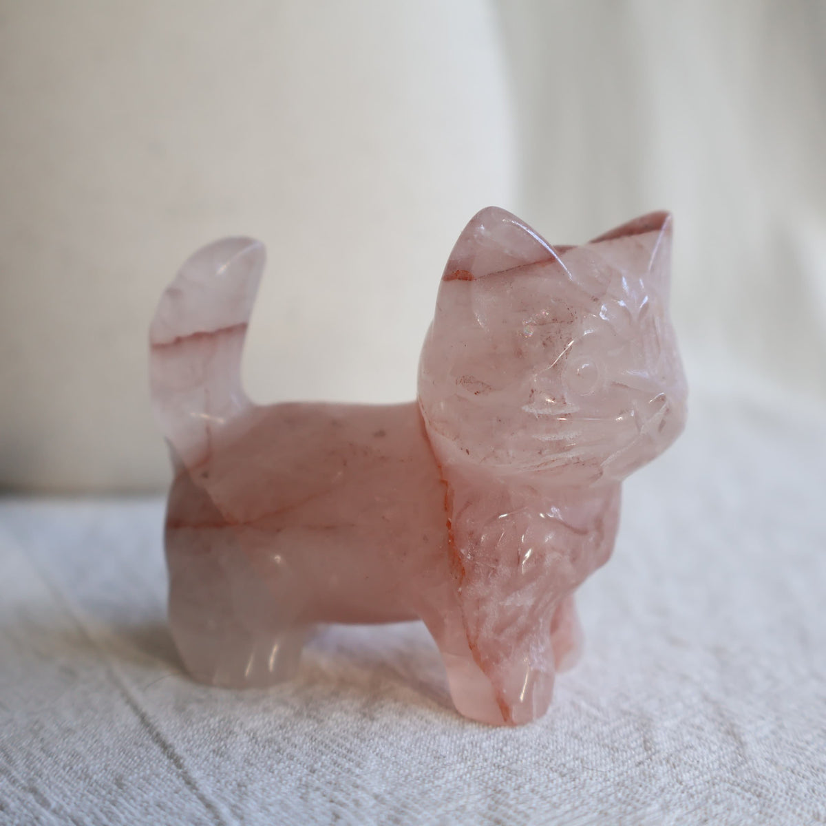Medium standing cat crystal carvings in Rose Quartz, Fire Quartz, Blue Aventurine and Larvikite, approximately 5cm tall.