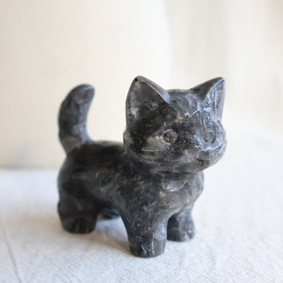 Medium standing cat crystal carvings in Rose Quartz, Fire Quartz, Blue Aventurine and Larvikite, approximately 5cm tall.