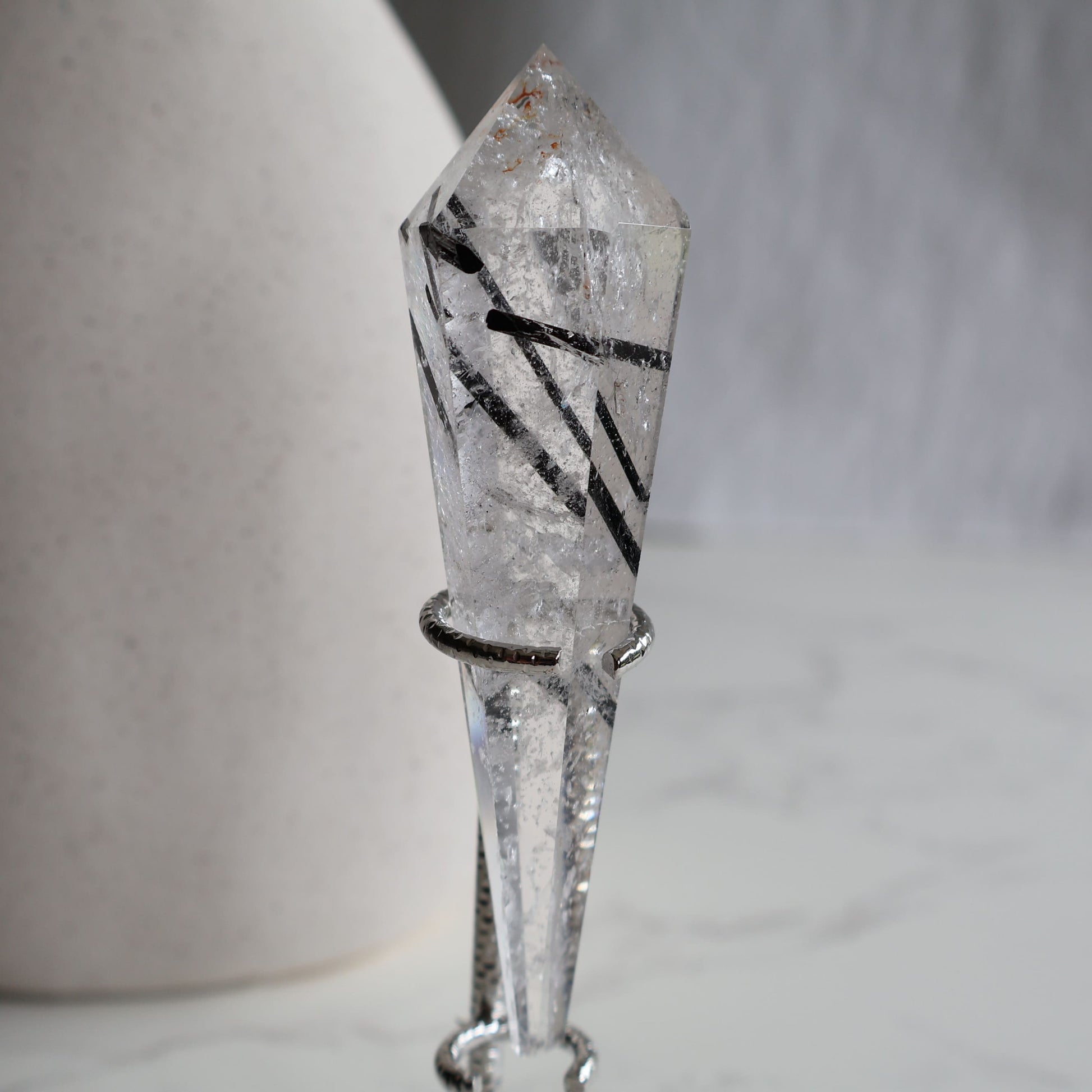 black tourmaline in quartz wand protection crystal