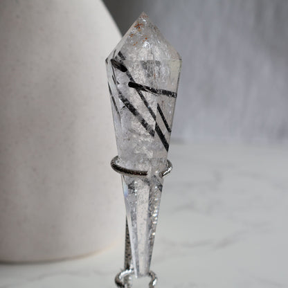 black tourmaline in quartz wand protection crystal